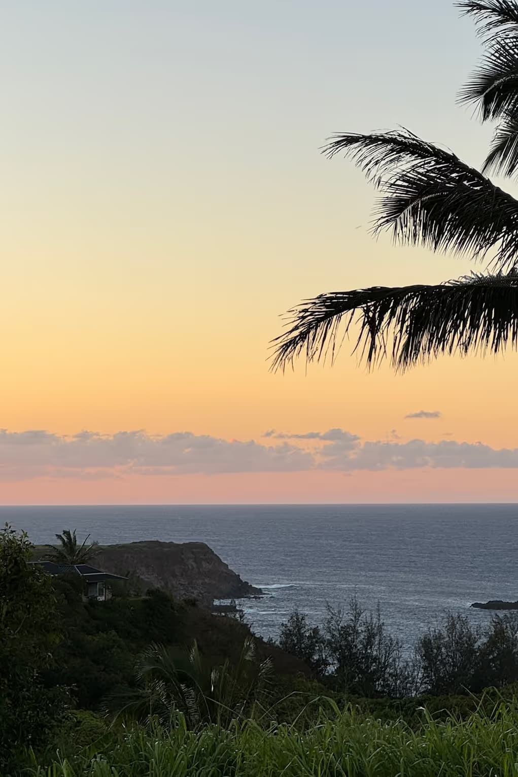 Sunset over the hills above Luna Farms in Haiku, Maui