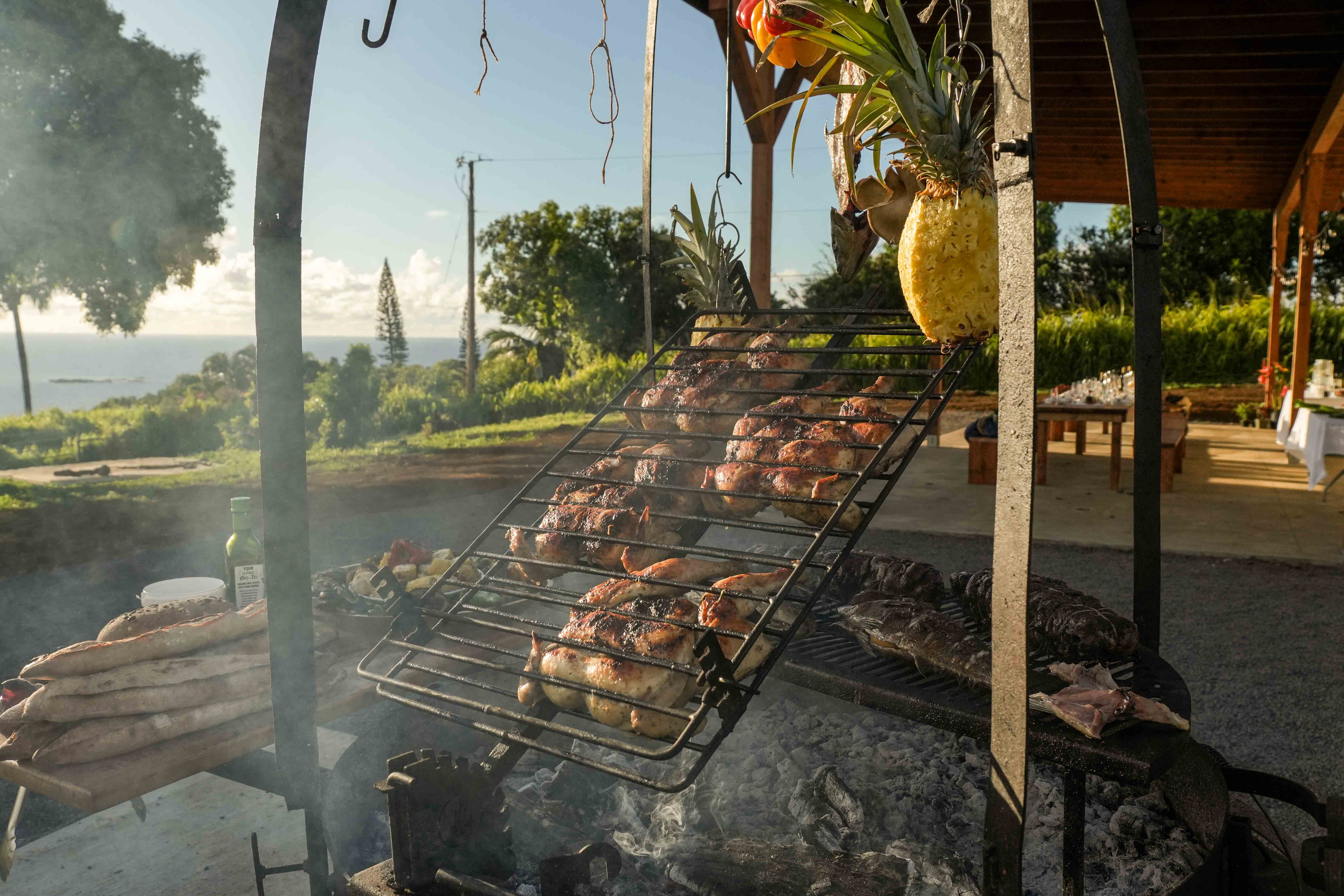 A full spread of meat roasting over the asado coals